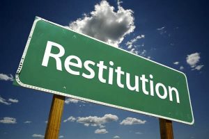 Restitution on a road sign
